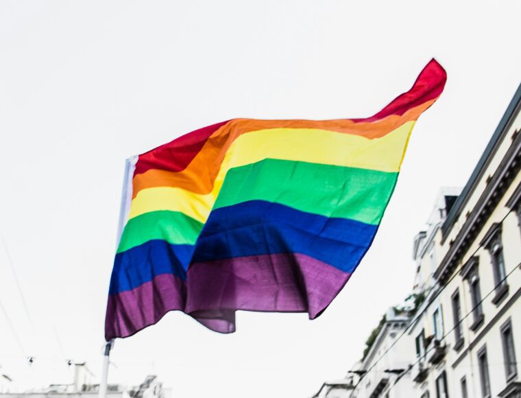 The LGBTQIA+ Pride Flag flying at a Pride Parade