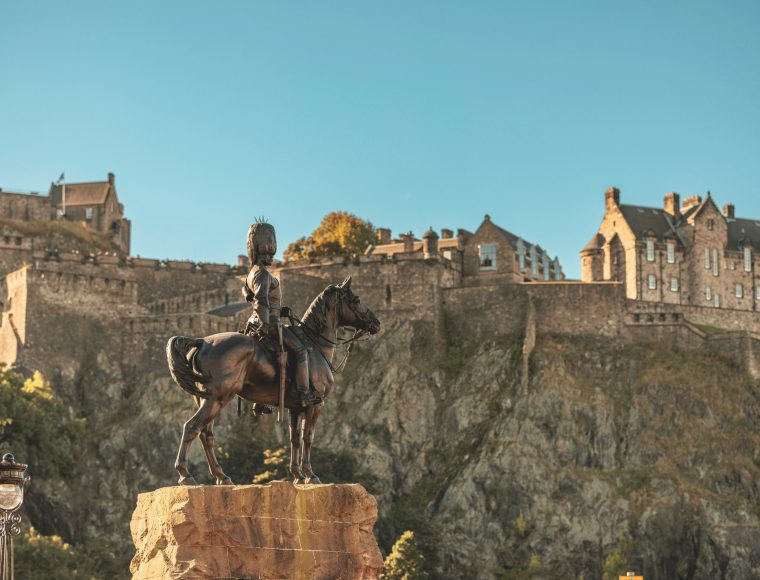 Edinburgh Castle and a bronze statue